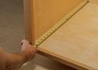 tape measure measuring a drawer room for cabinet slides